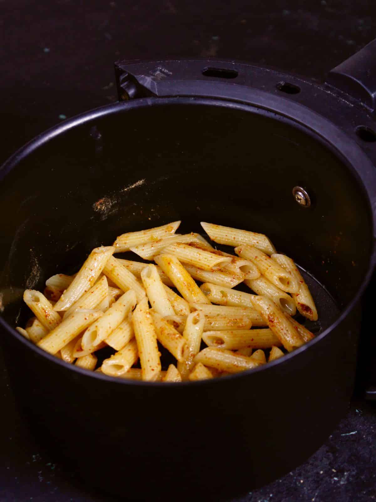 transfer the coated pasta in an air fryer 