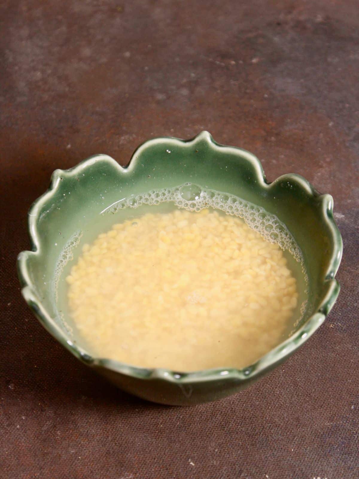 soaked yellow lentils in a bowl 