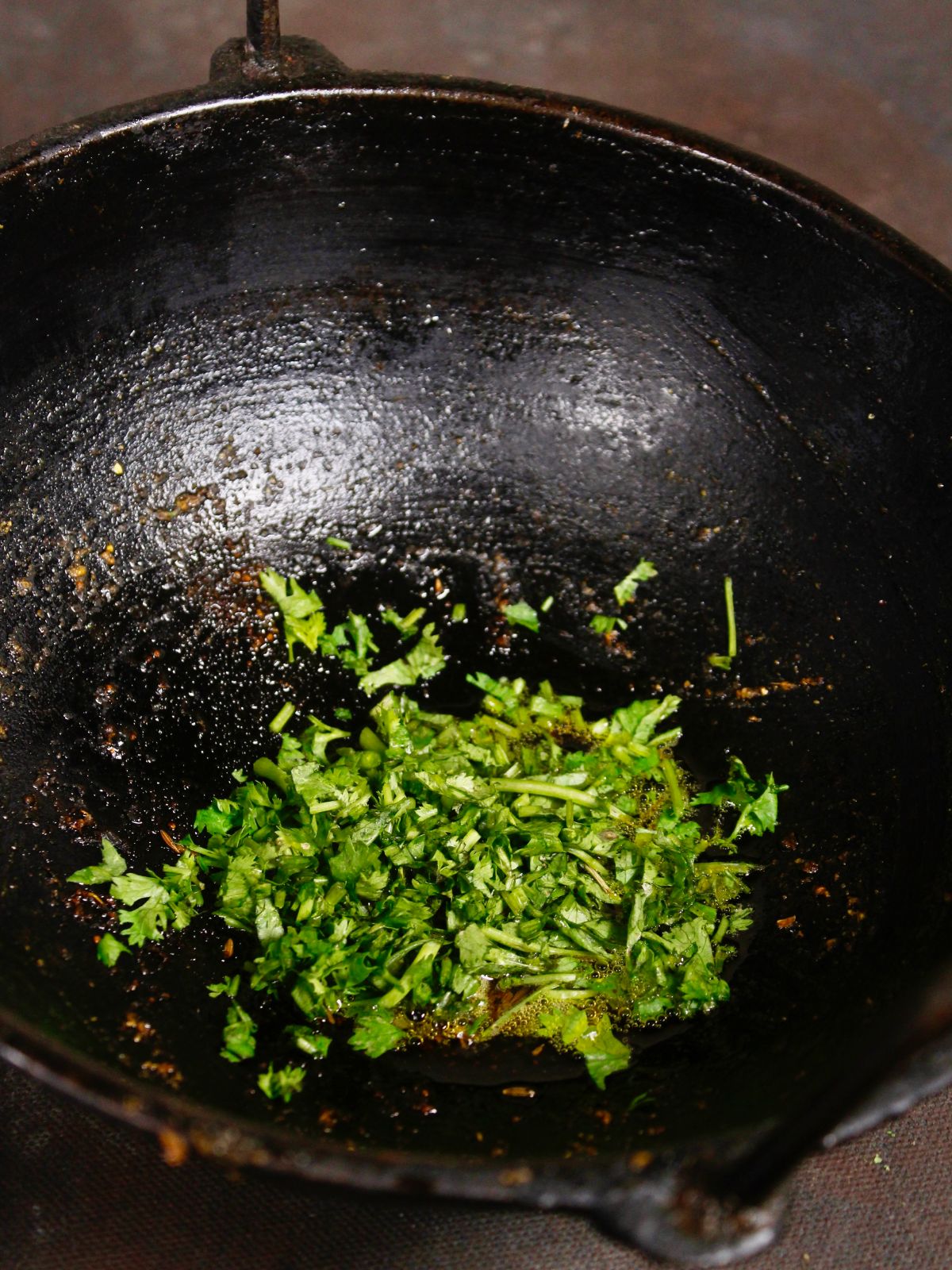 add chopped coriander leaves to the pan and mix well 