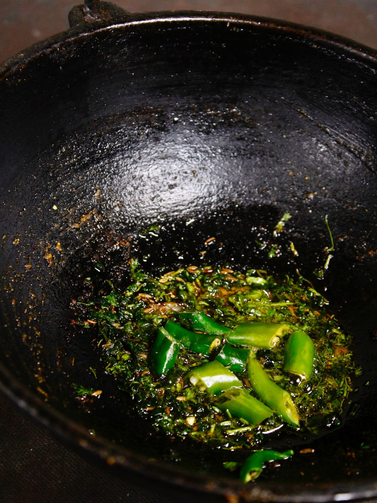 add green chilies to the pan and mix well 