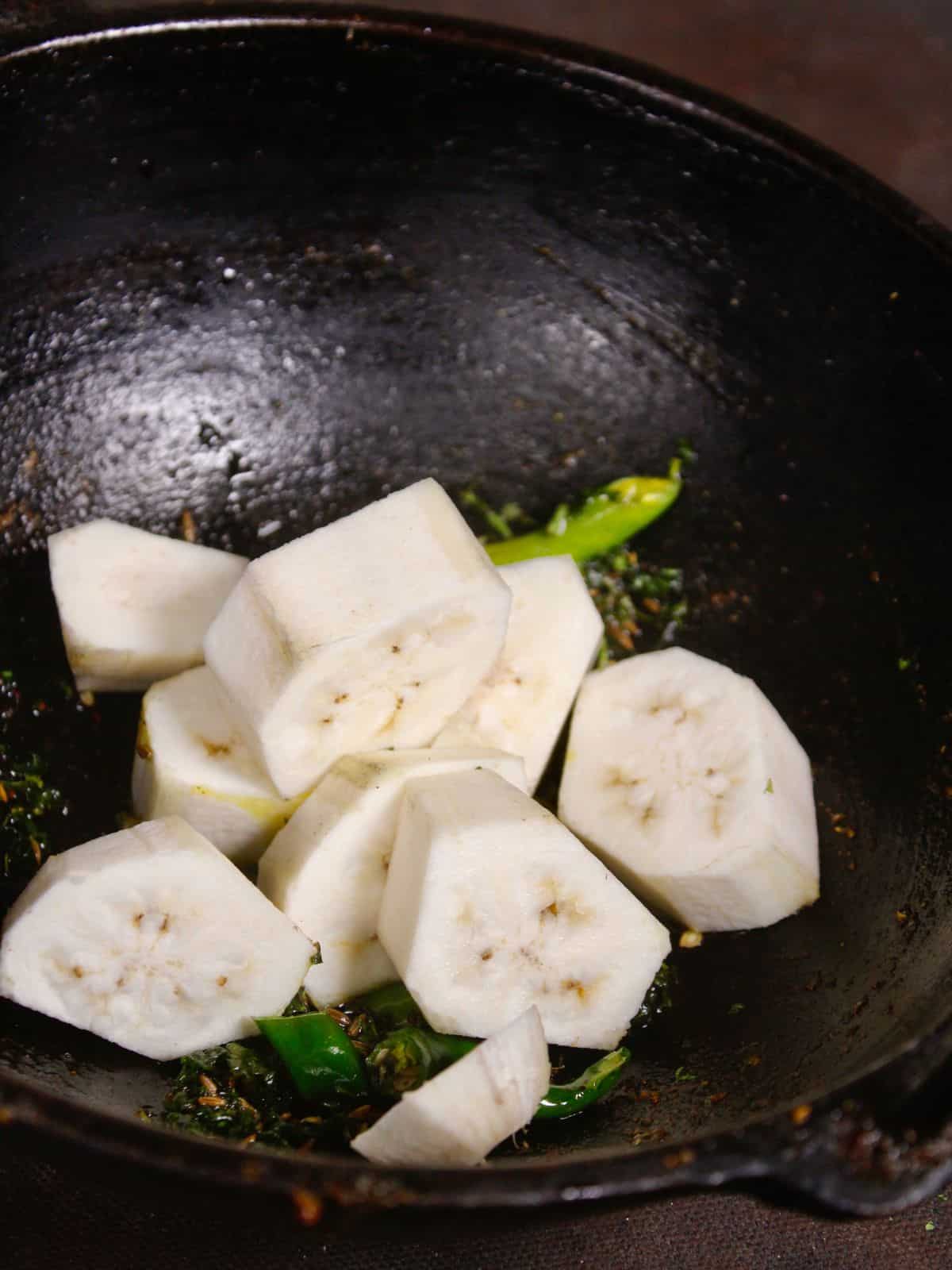 add diced bananas to the pan and mix well 