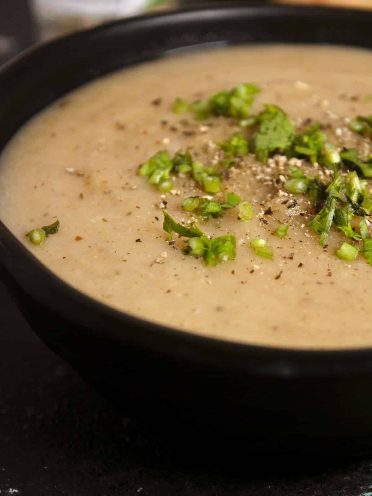 side view zoom in image of creamy vegan potato soup