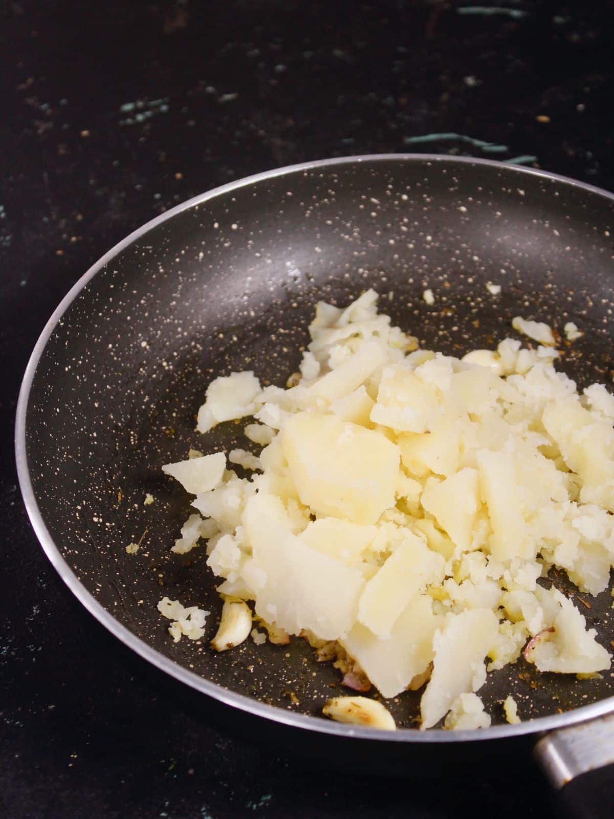 add mashed potatoes to the pan 