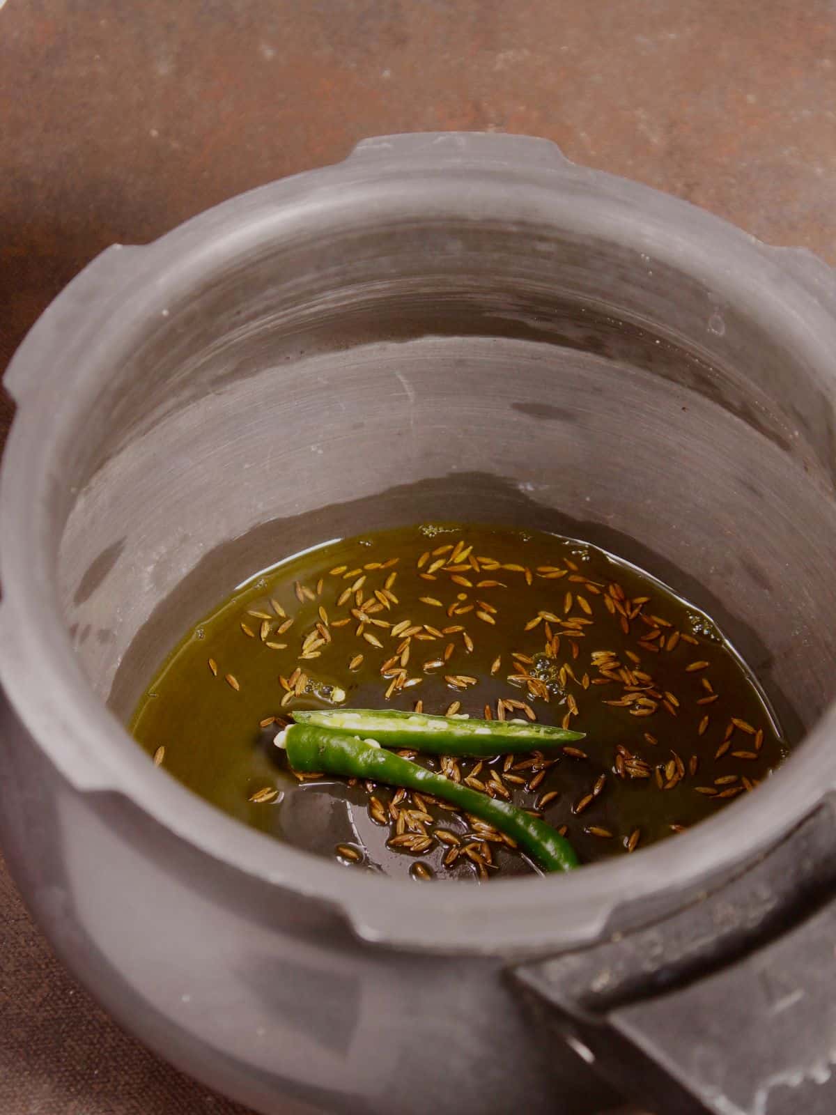 saute seeds, chilies and oil 