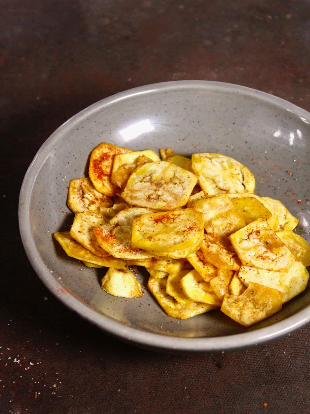 enjoy yummy red hot banana chips with tea