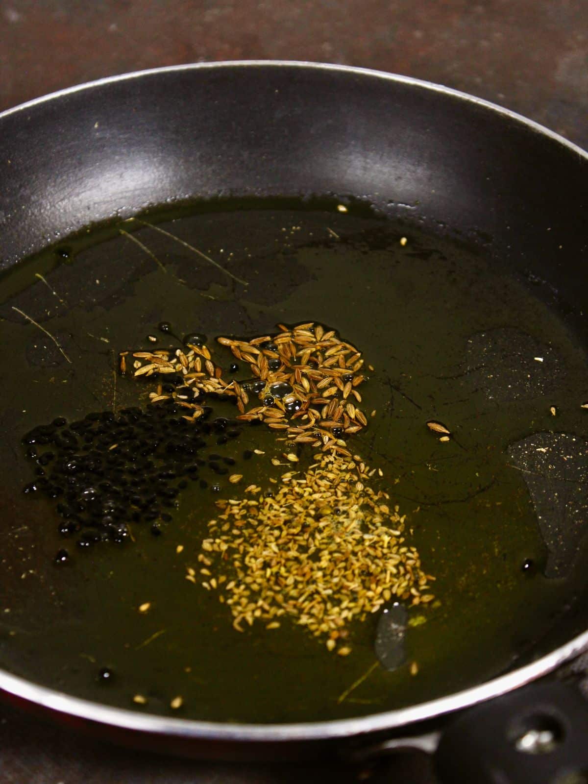 saute seeds with oil in a pan 