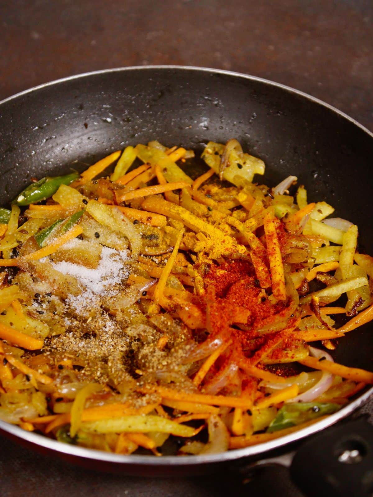 add powdered spices to the pan and cook 