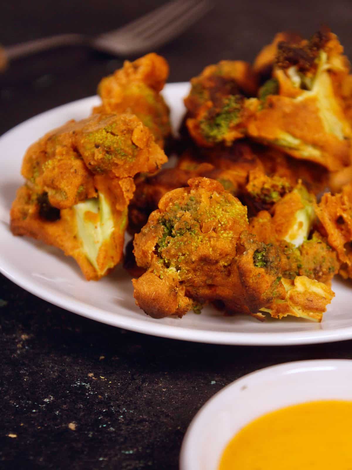 side view of air fried buffalo broccoli bites