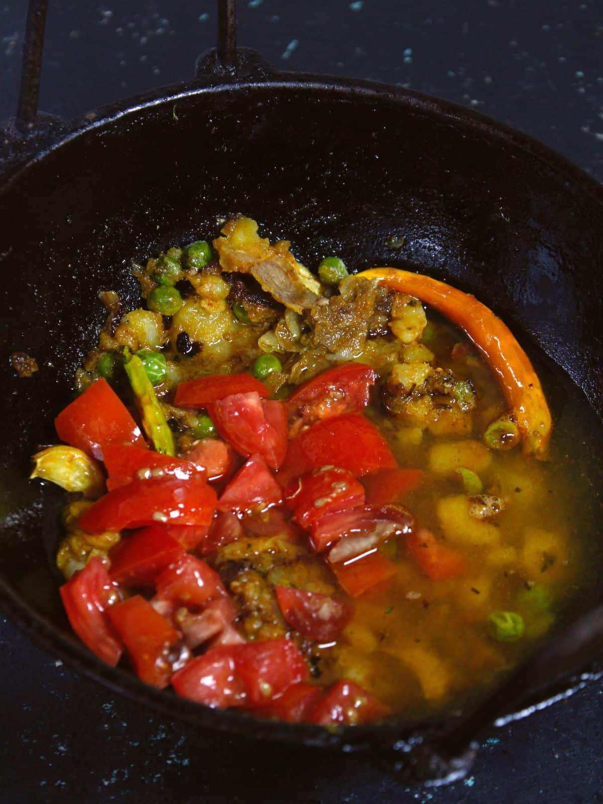 add chopped tomatoes and water to the kadai and cook well  