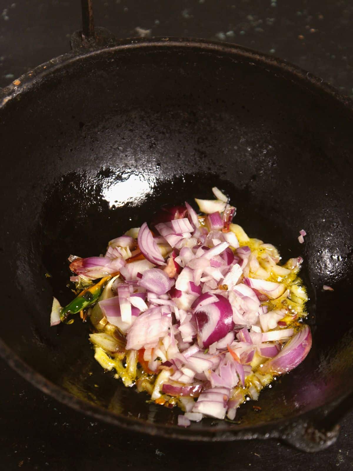 add chopped onions to the kadai 