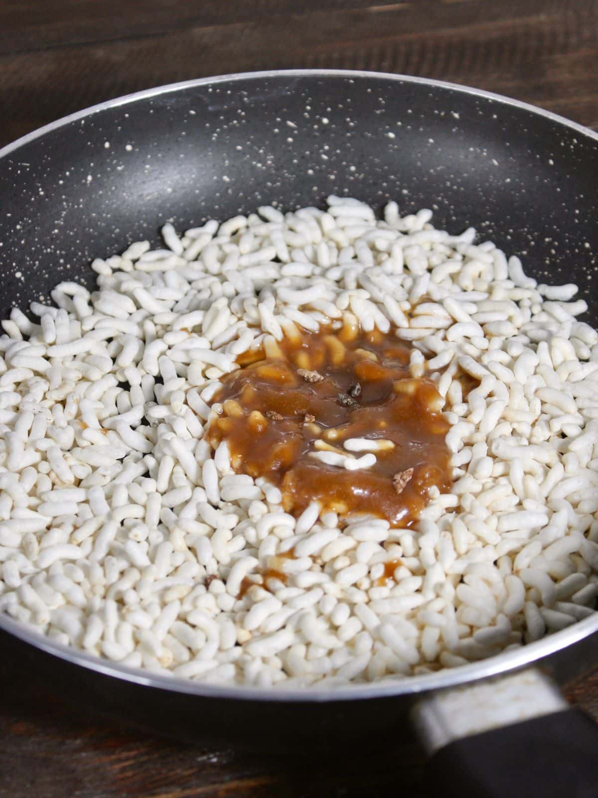 add caramel over the puffed rice 