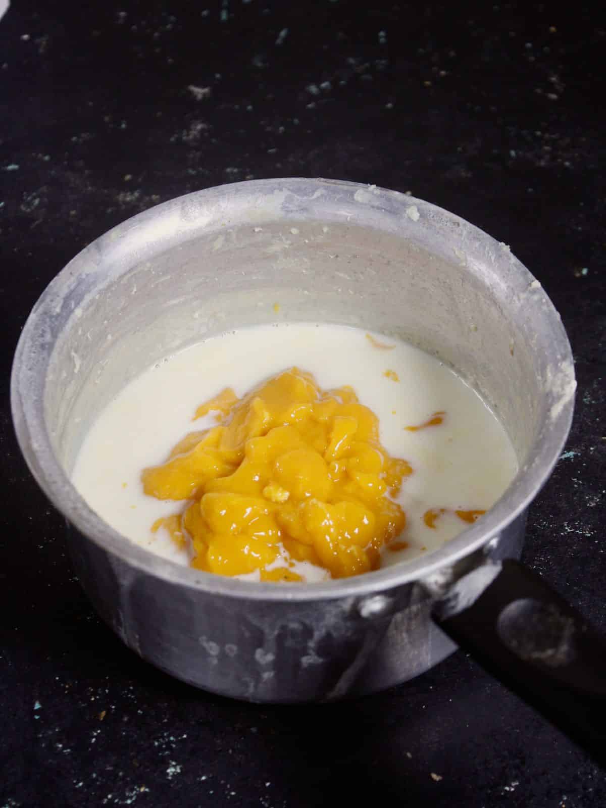 add mango pulp to the milk