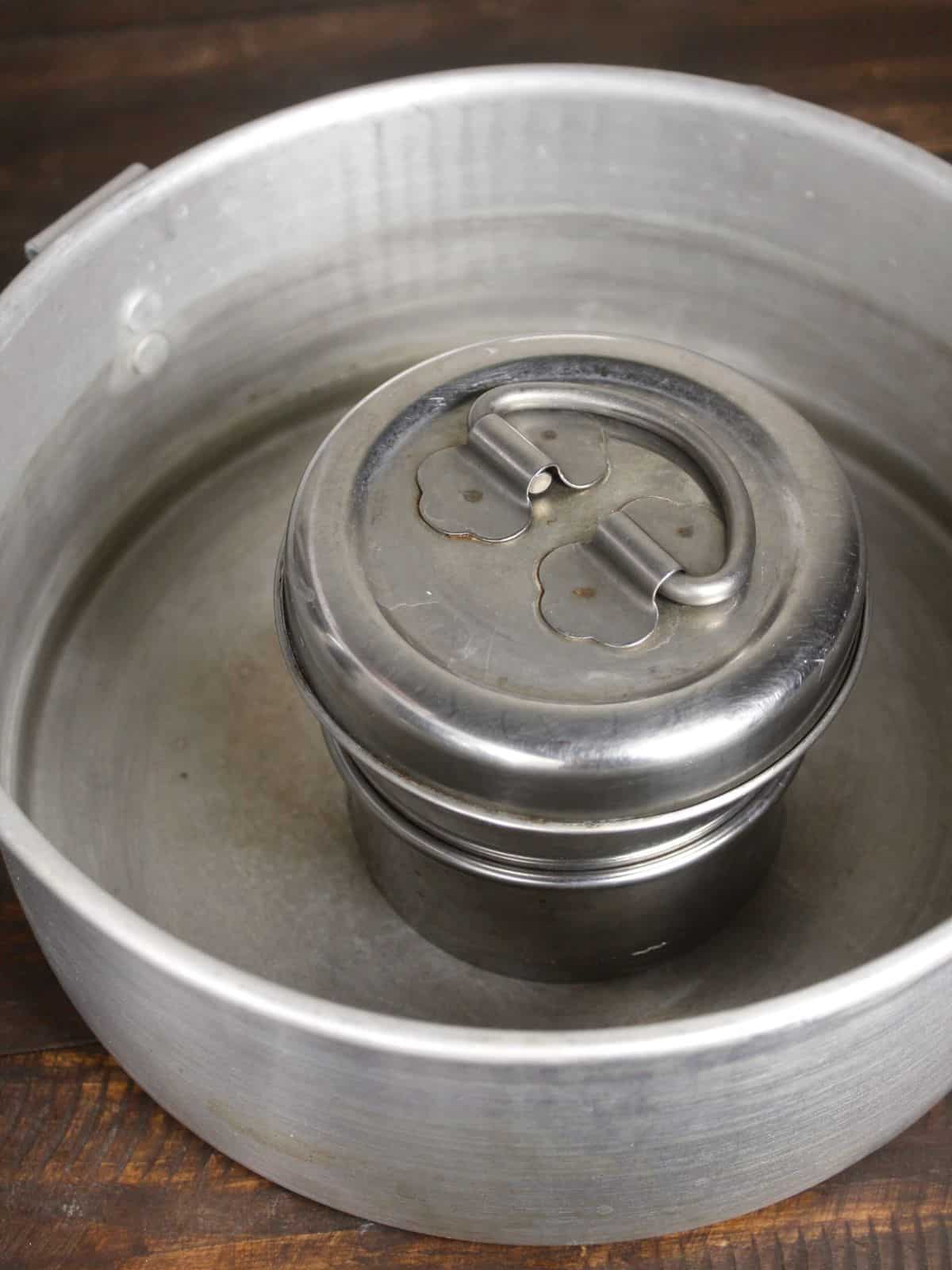 transfer the millet paste into a steel container and  cover the lid