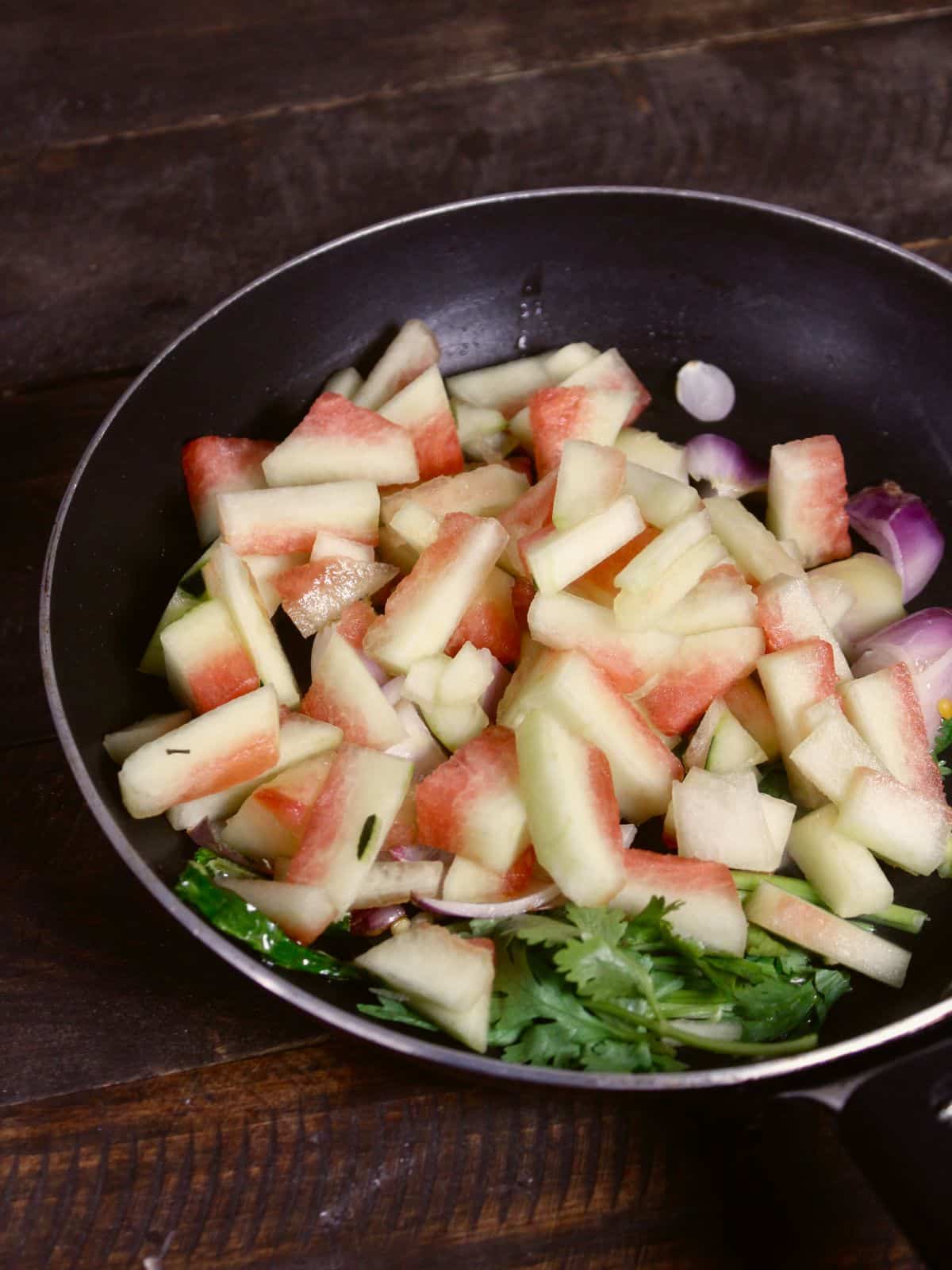 add chopped rind pieces into the pan and cook 