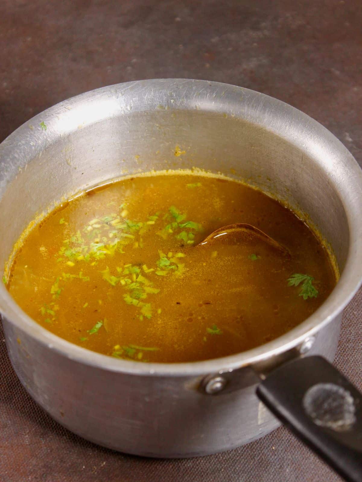 add chopped coriander leaves to the soup and cook 