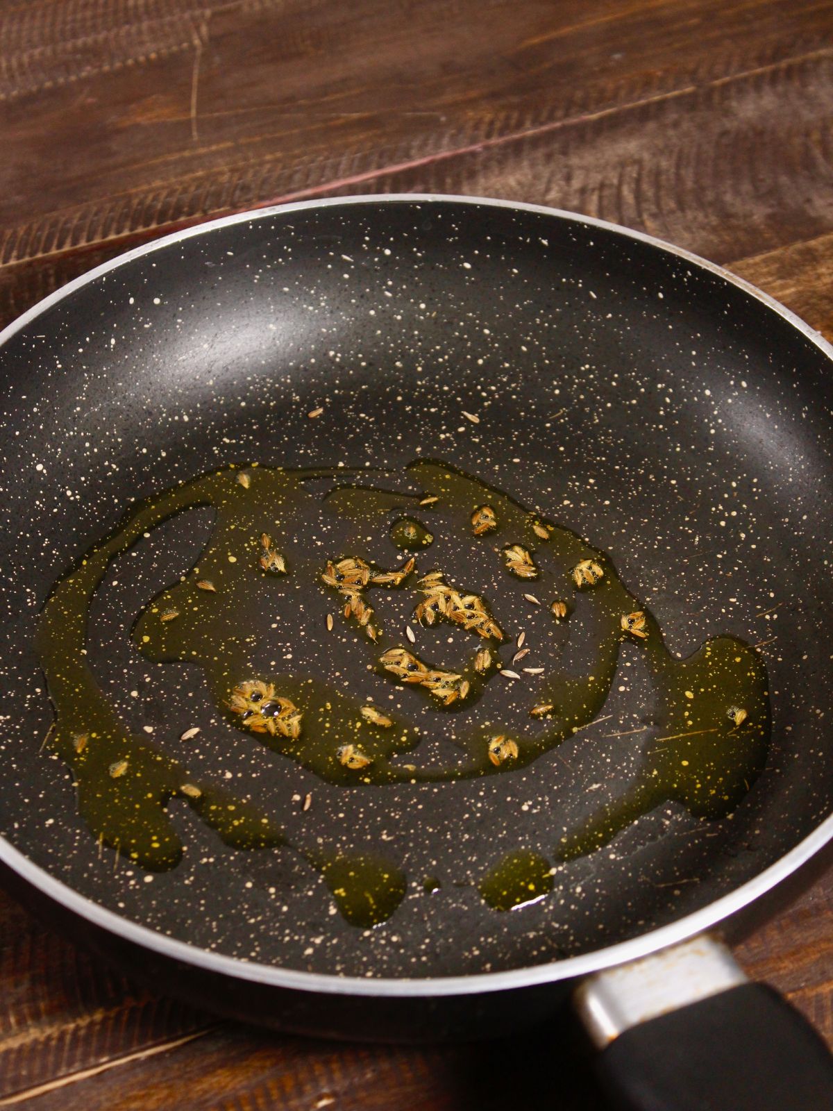 cumin seeds in a pan 