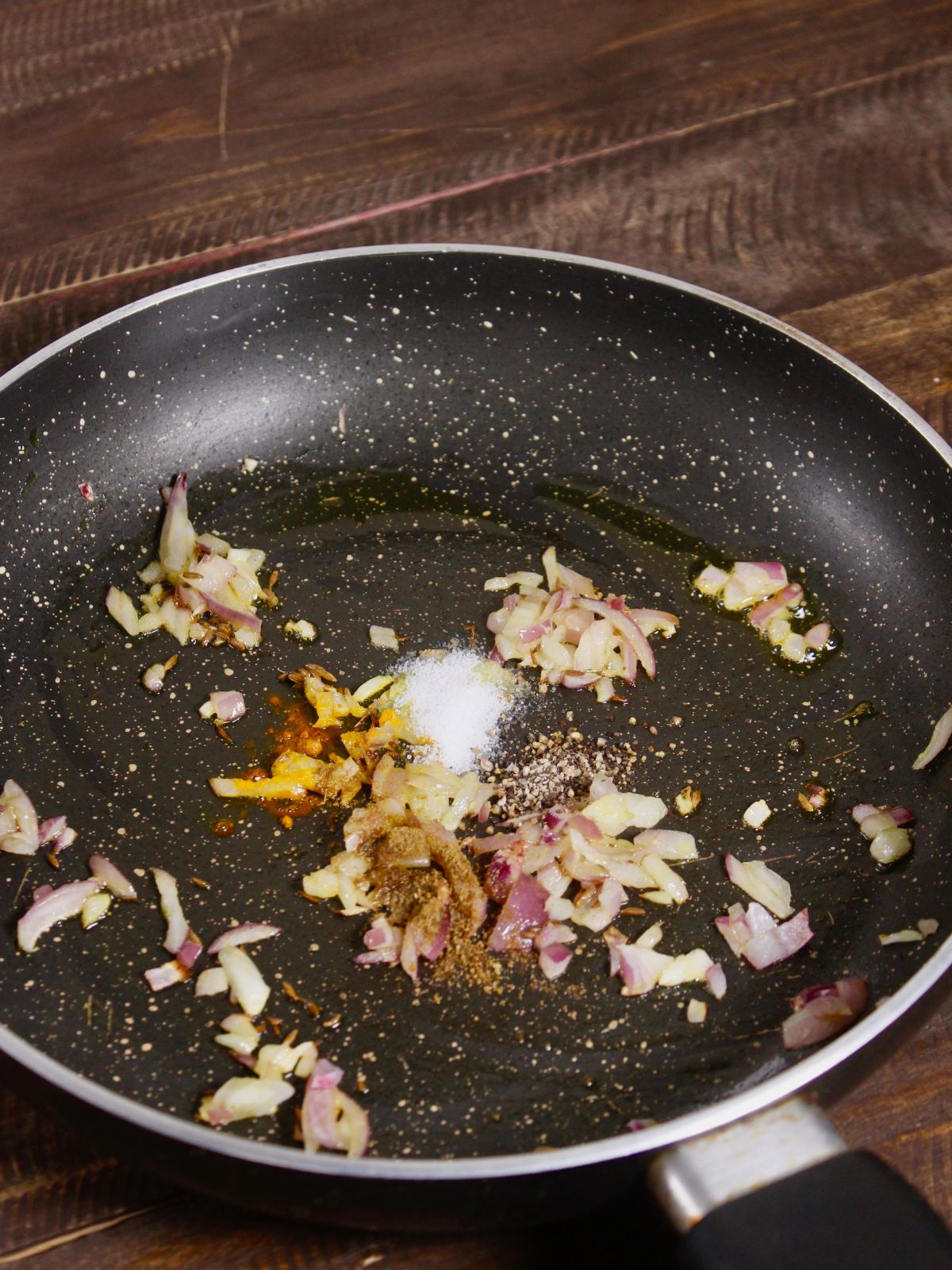 add powdered spices to the pan 