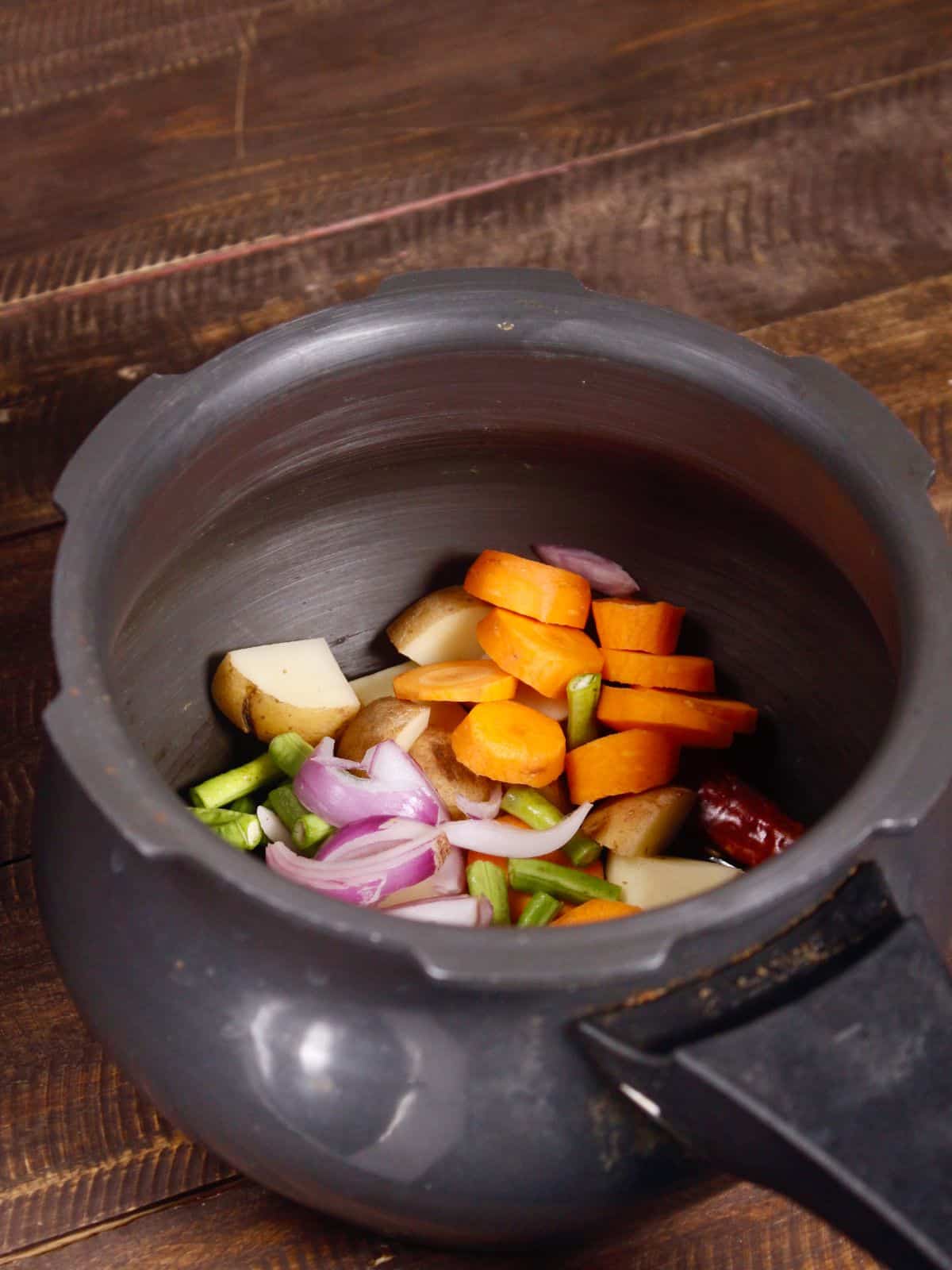 add chopped vegetables to the pot