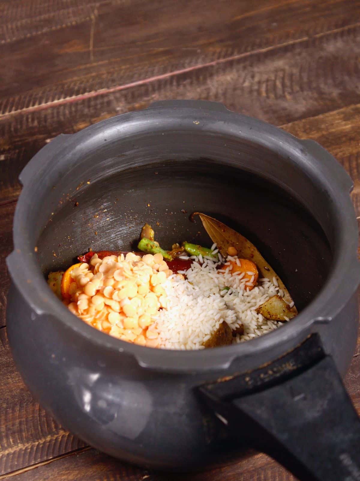 add soaked red lentils and rice to the pot 