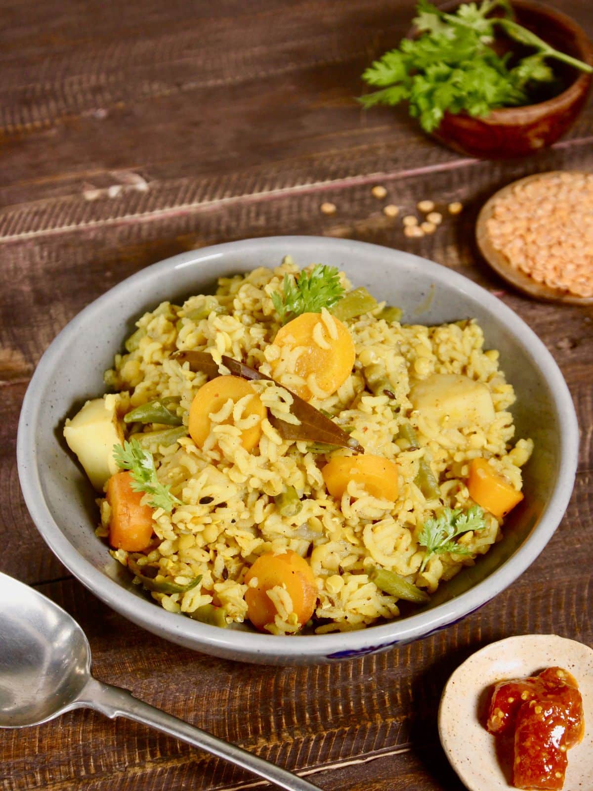 garnish with coriander leaves in a bowl and serve hot with papad or pickle  