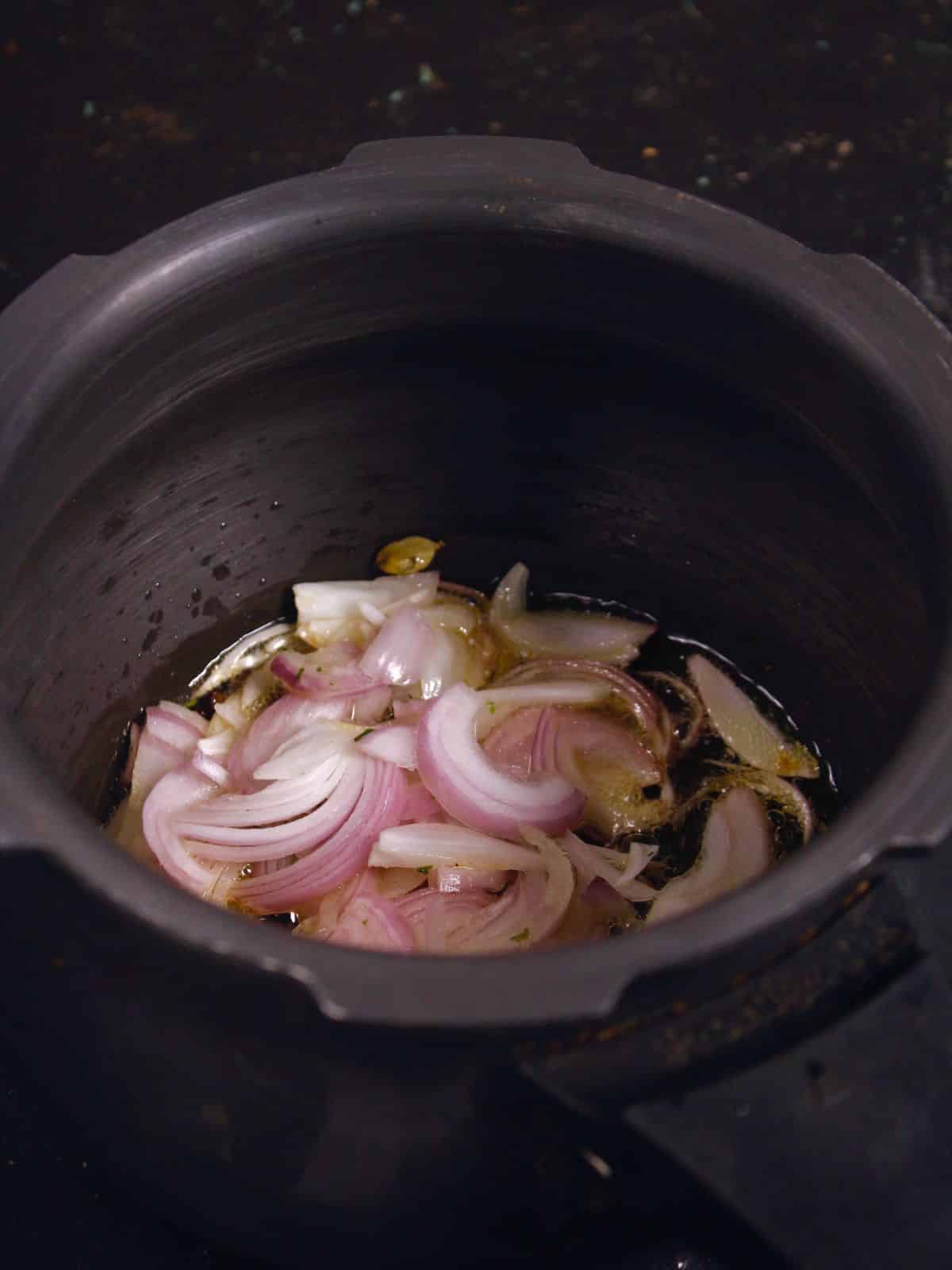 add sliced onions to the pot 