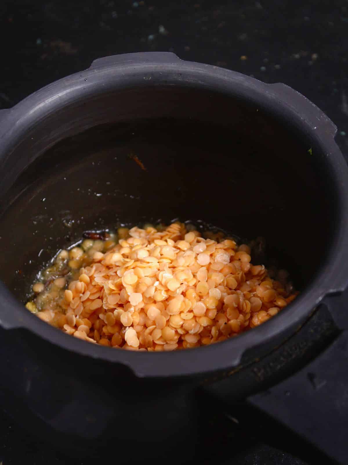 add soaked red lentils to the pot 