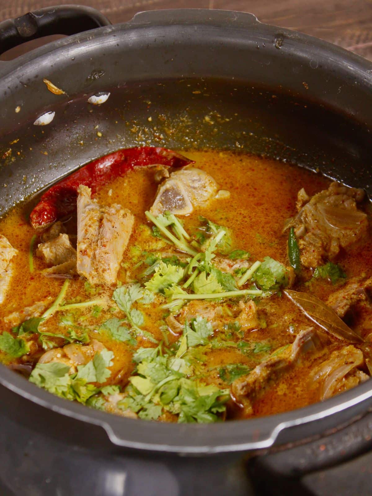 add water and coriander leaves to the pot and cook well 