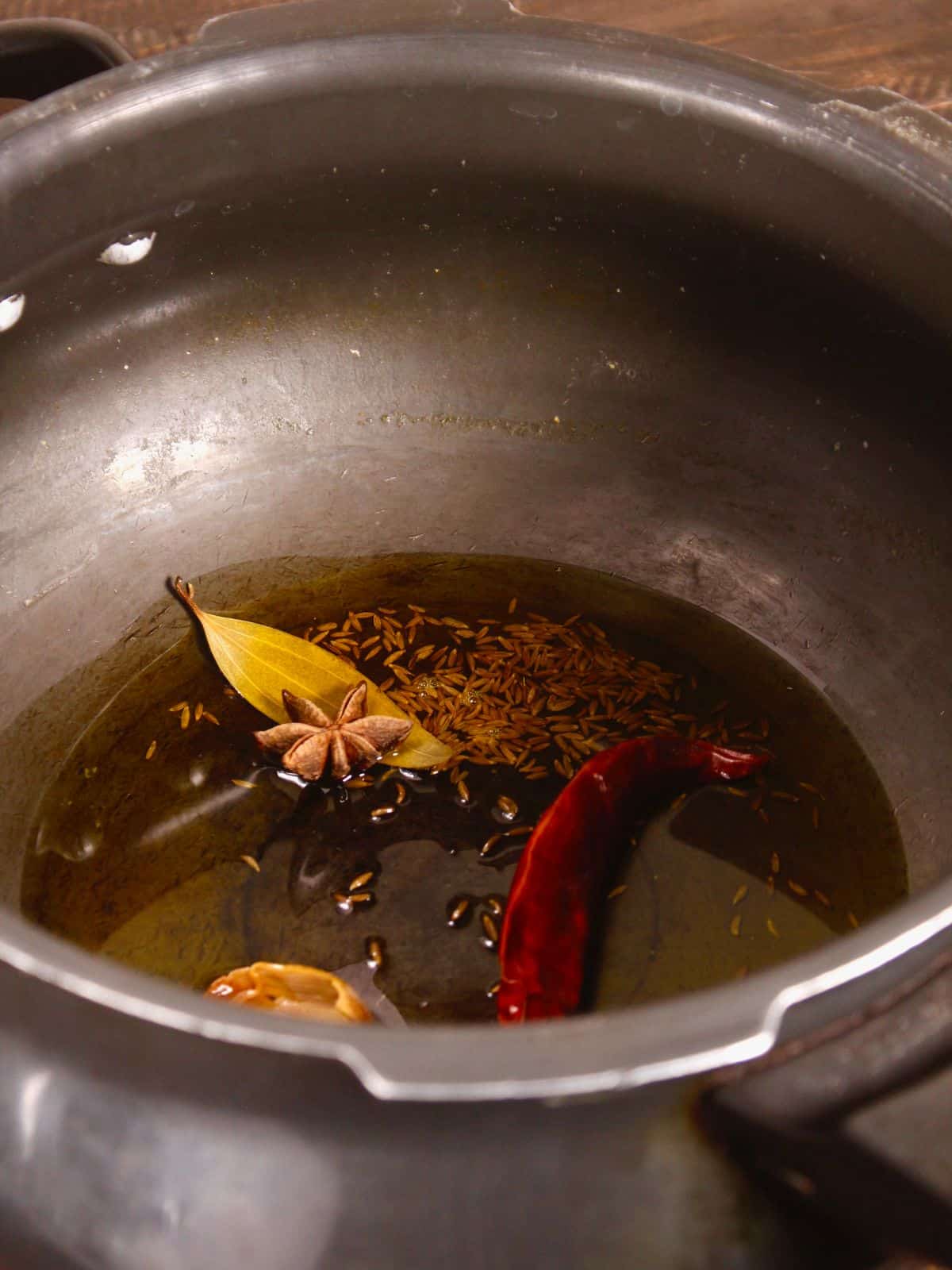 cumin seeds, leaf etc in a pot 