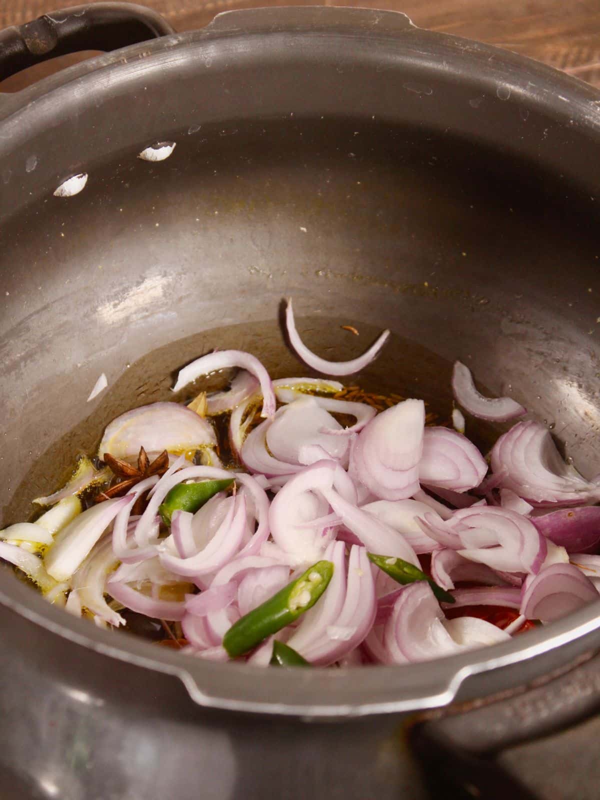 add sliced vegetables in a pot 