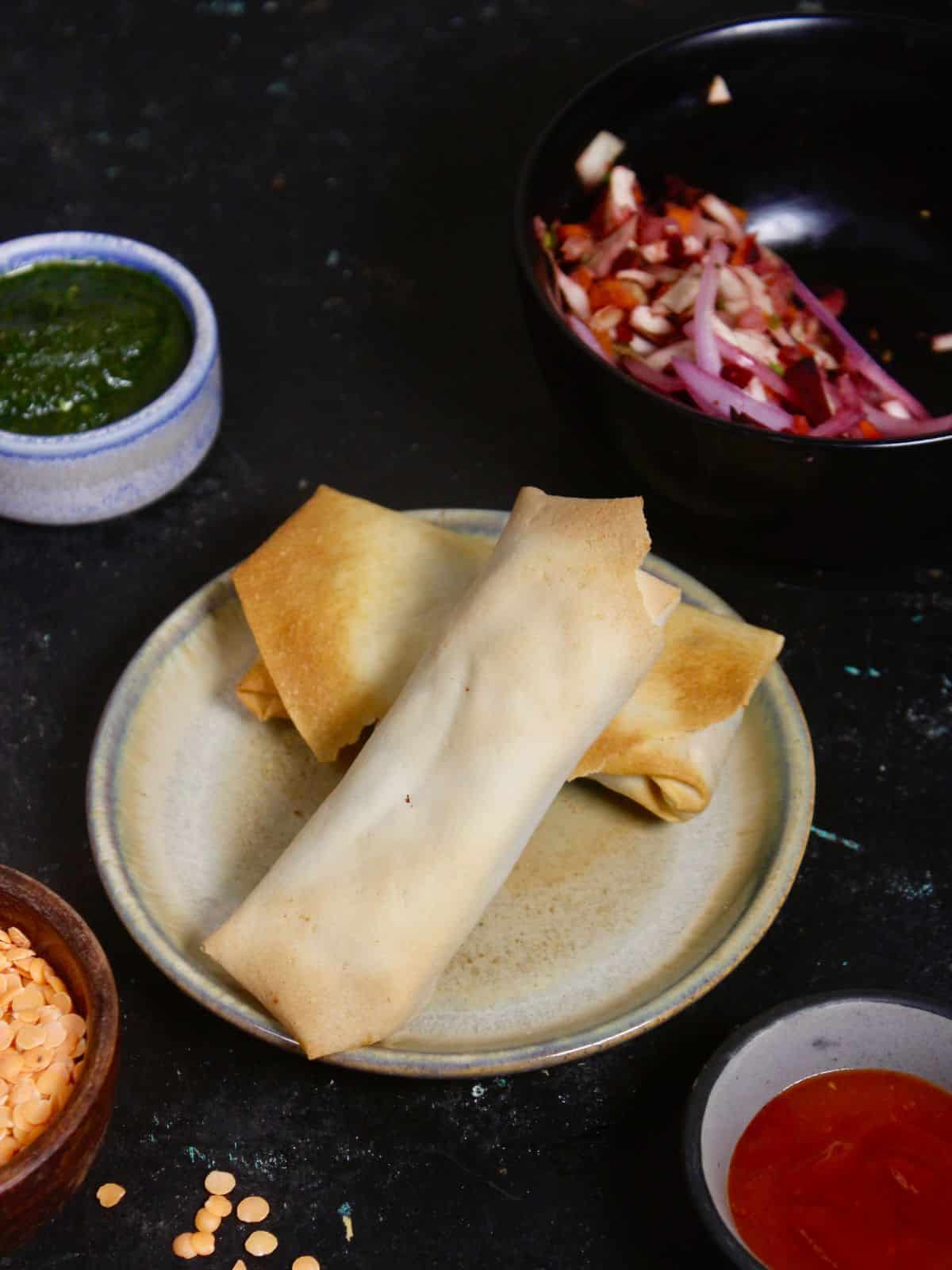 tasty air fried masoor rolls ready to enjoy with ketchup and chutney 