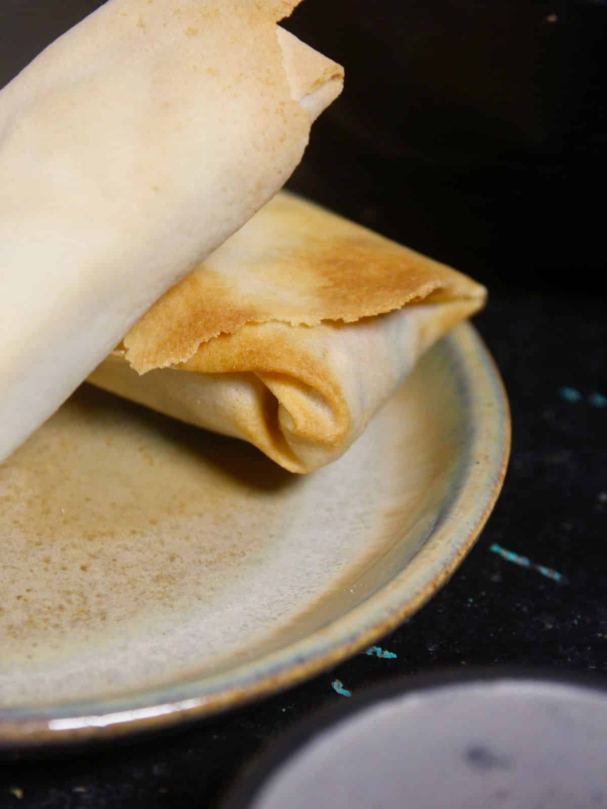 side view of air fried masoor rolls