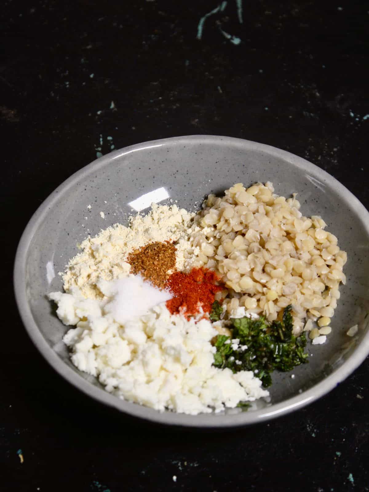 mix soaked lentils with other ingredients in a bowl 