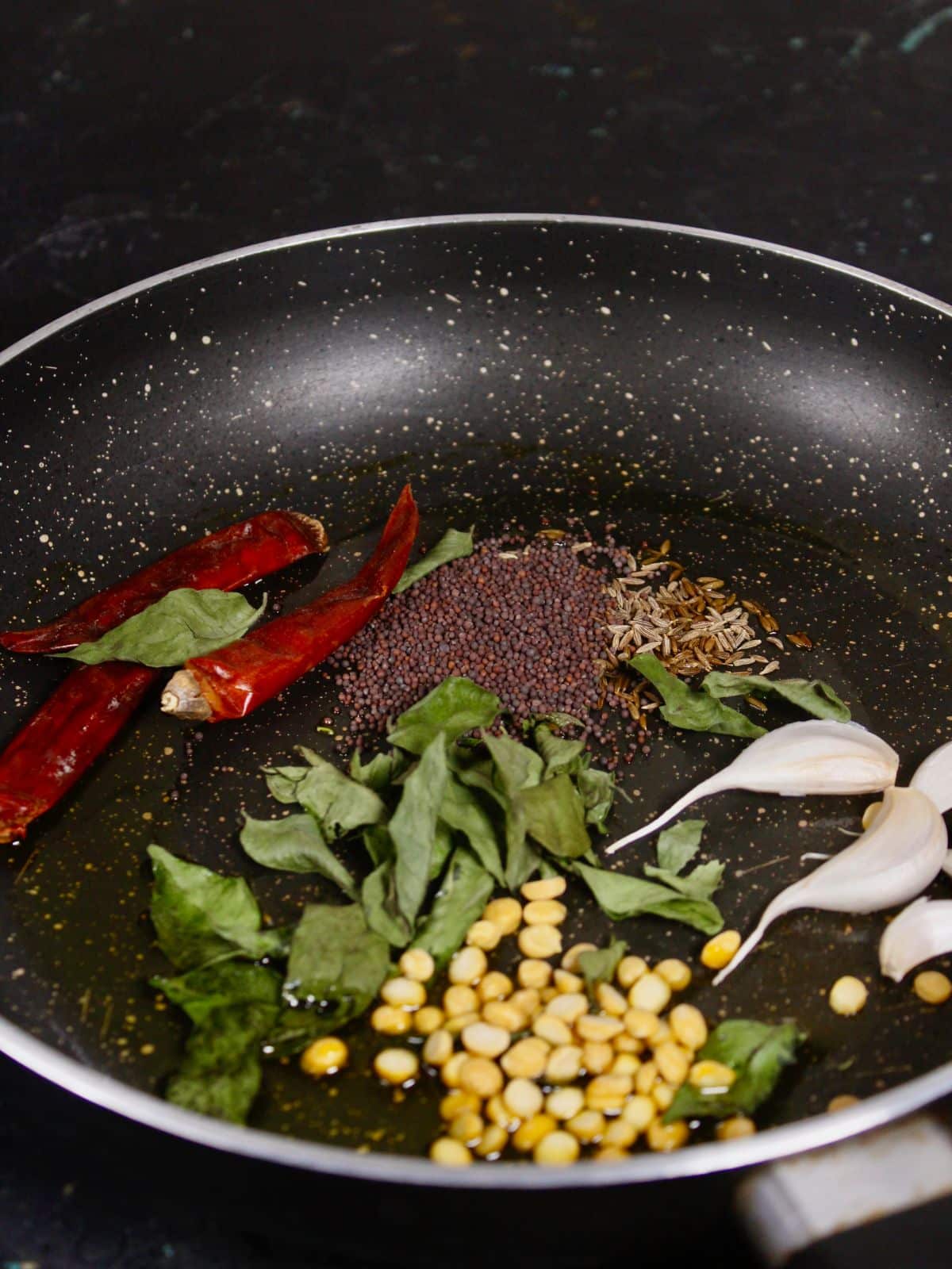 take seeds and leaves into the pan and saute 