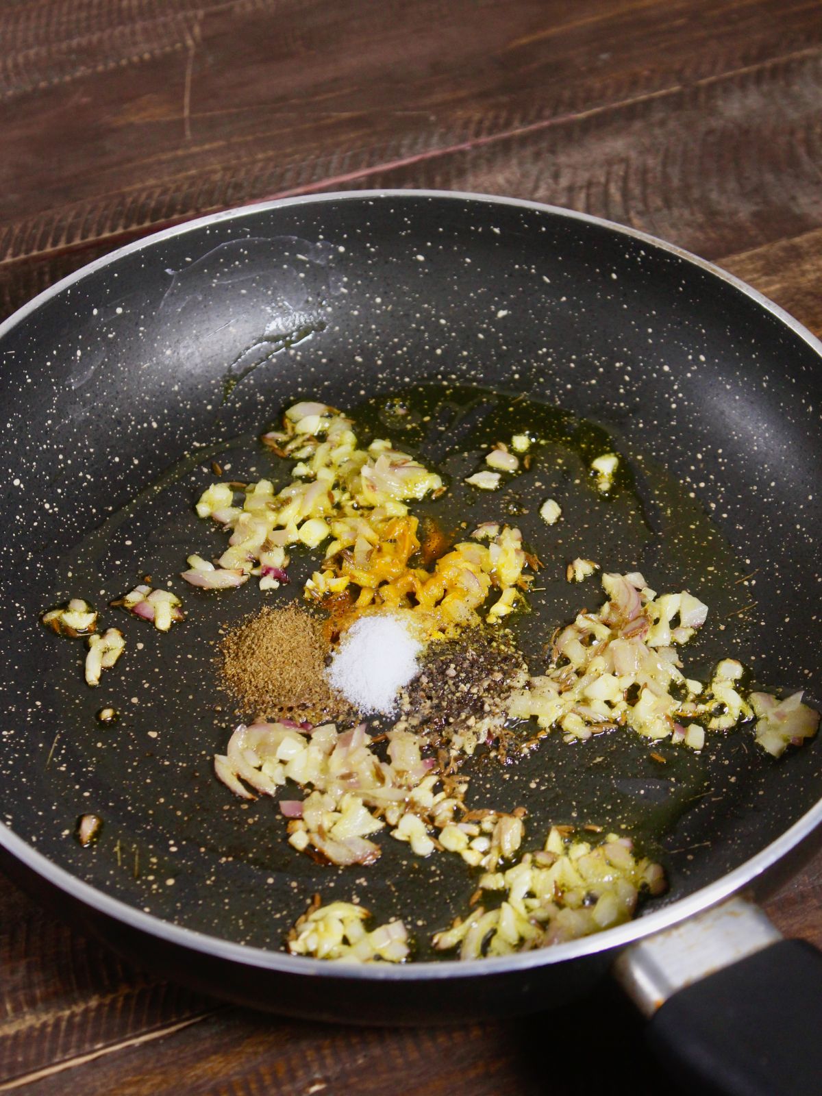 add powdered spices to the pan and let them crackle 