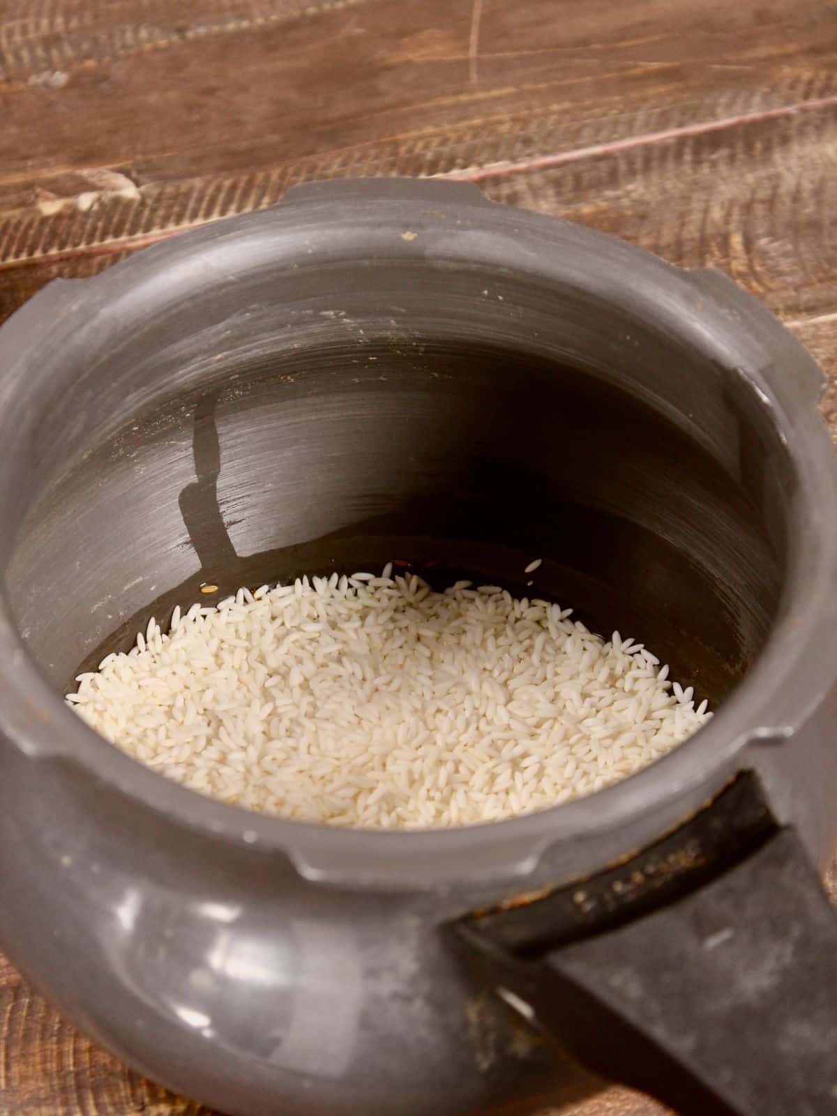 add soaked rice to the pot and let it cook 