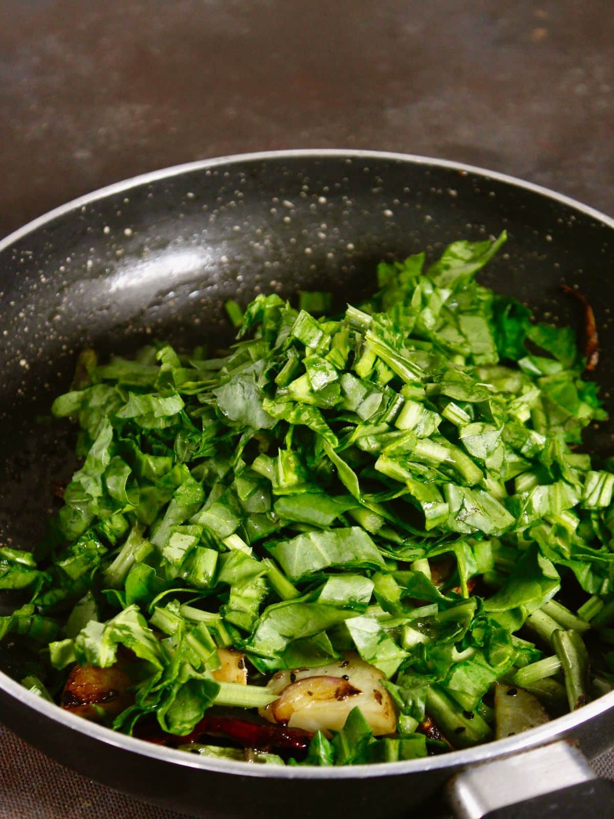 add spinach to the pan and mix well 