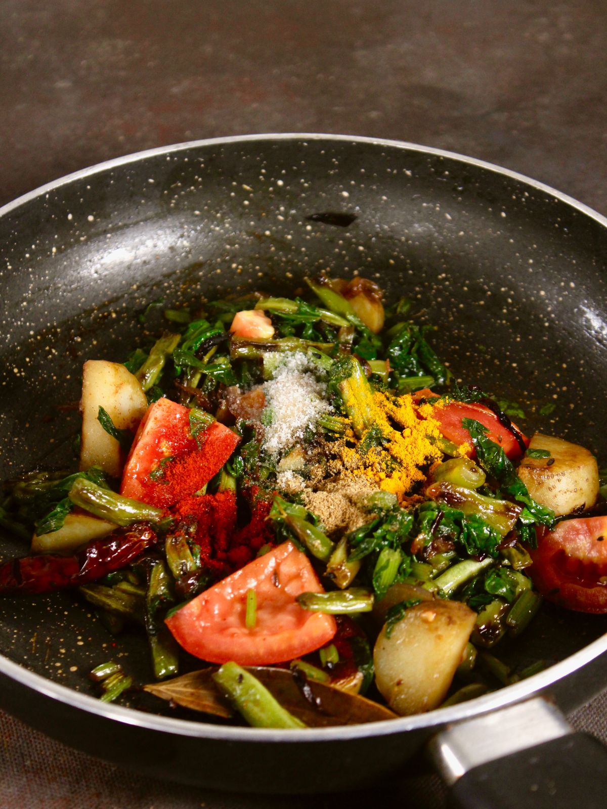 add powdered spices to the pan 