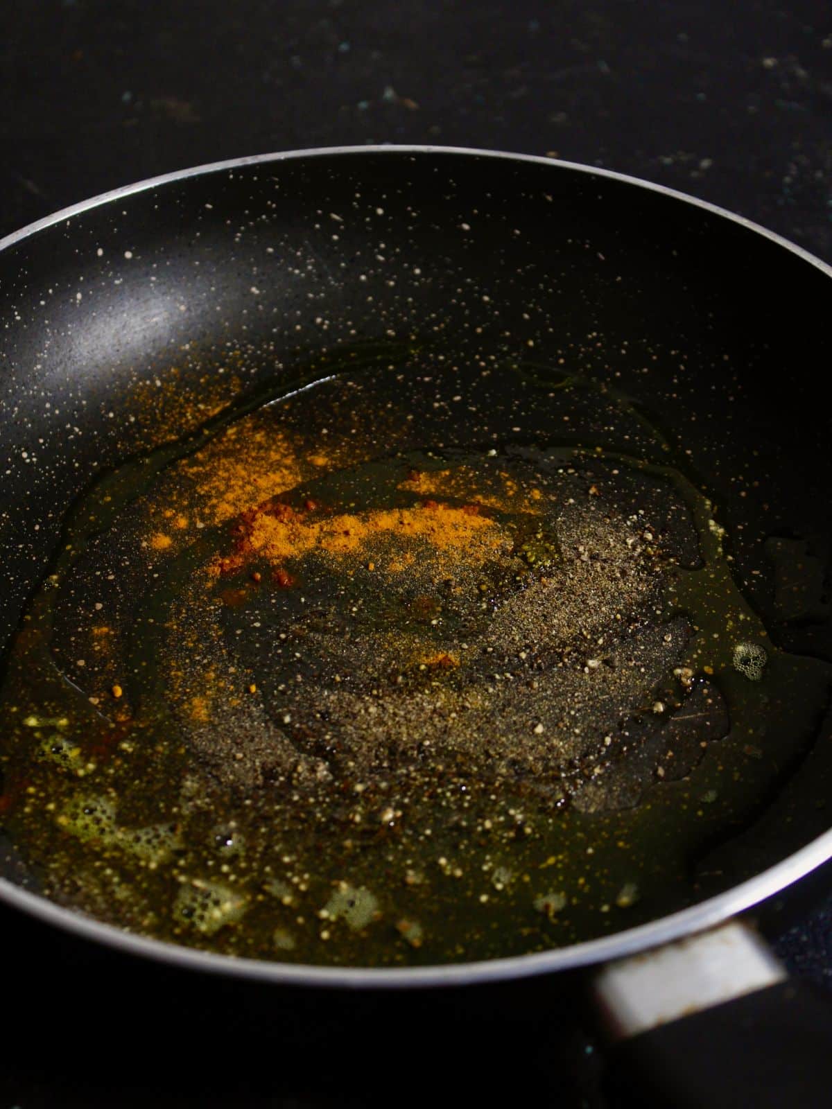 add spices with oil in a pan 