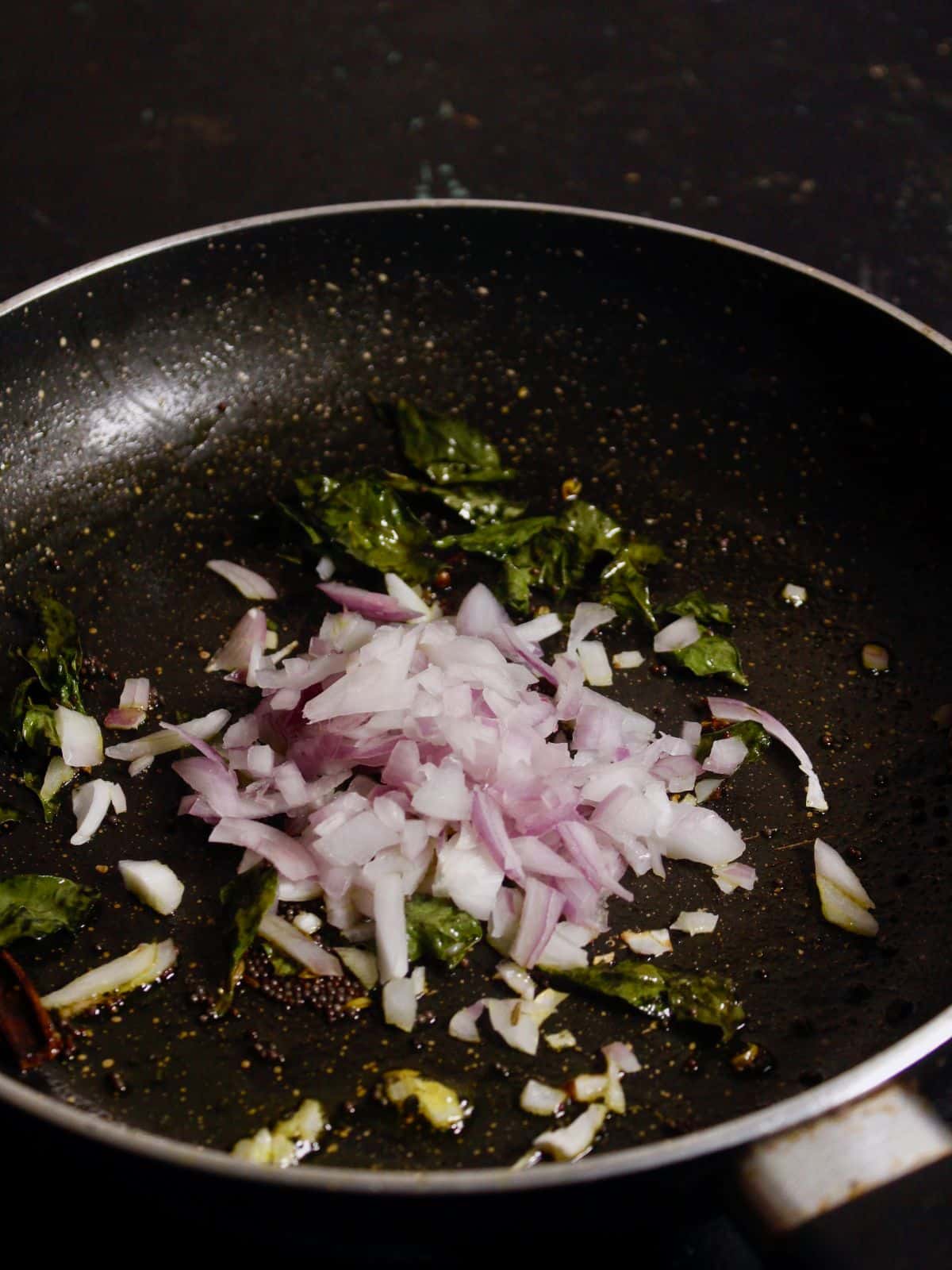 add chopped onions in tha pan and mix well 