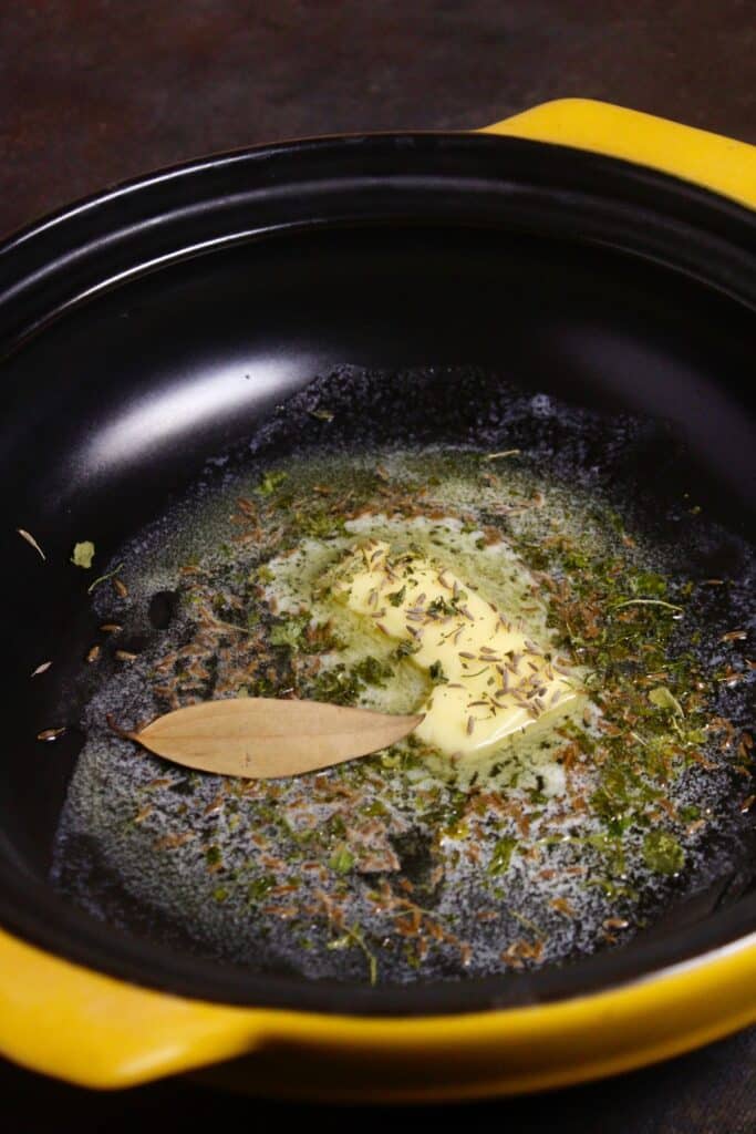 add cumin seeds, bay leaf, fenugreek leaves and butter in a pan and saute 