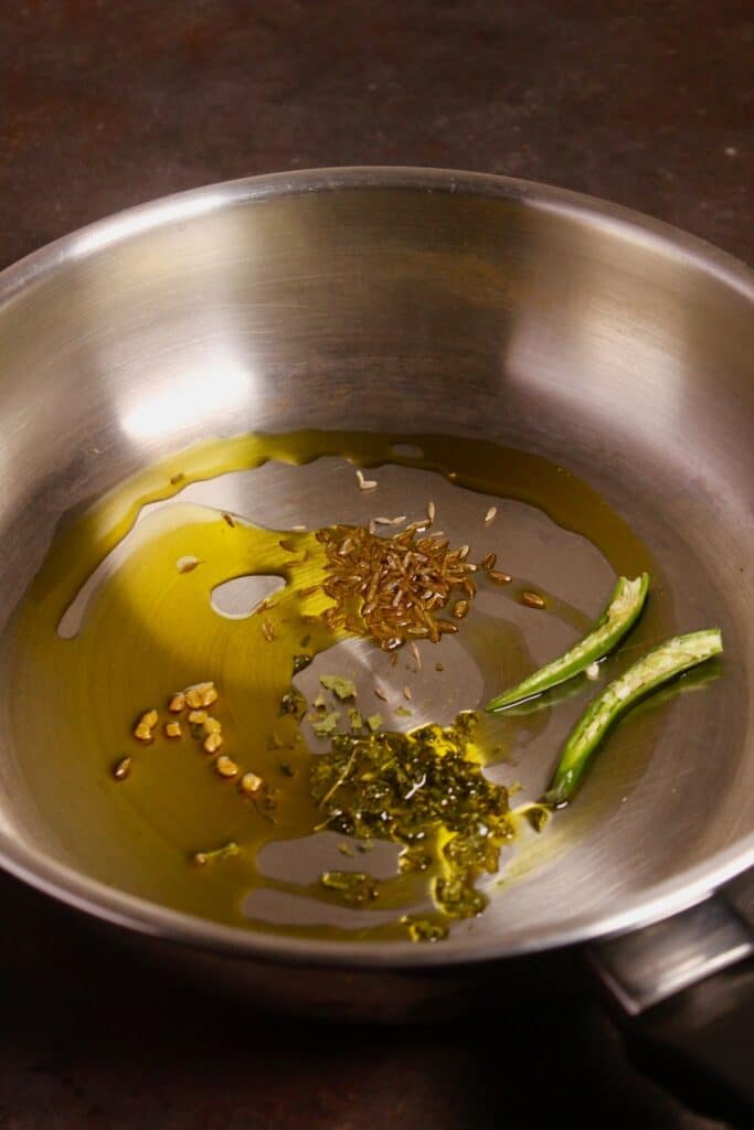 add seeds and oil in a pan and saute 