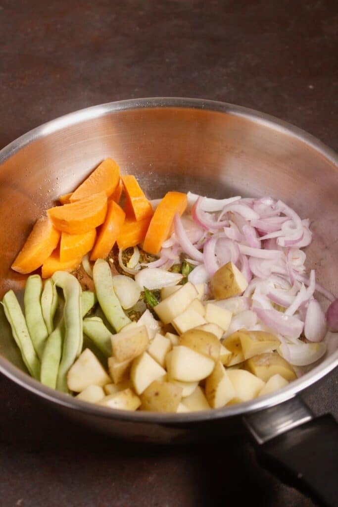 add chopped vegetables to the pan