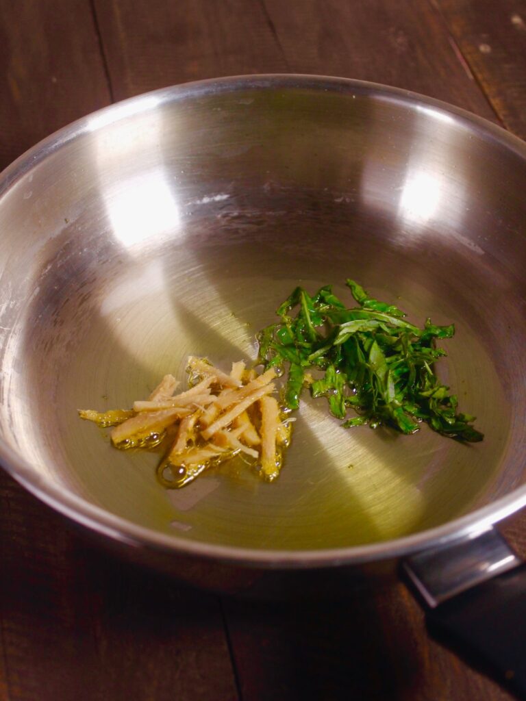 add ginger and basil leaves in a pan with oil and saute 