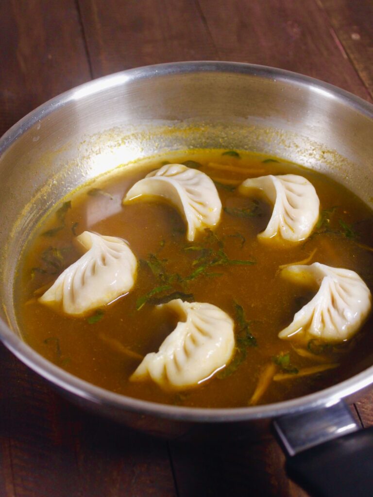 add thawed momos into the mixture and cook 