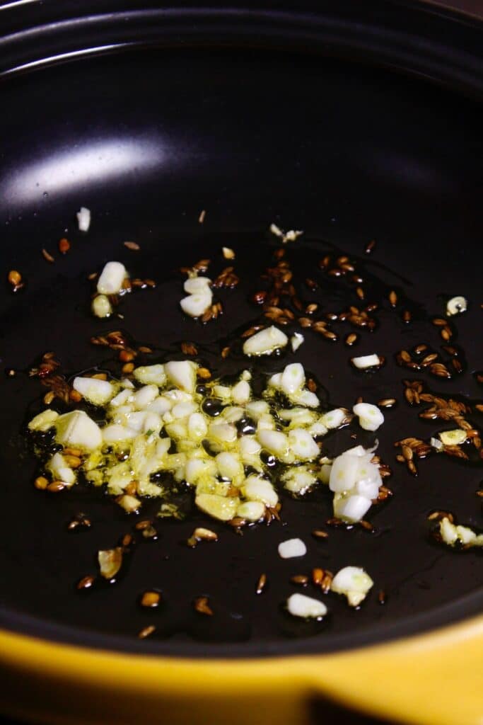 add chopped garlic to the pan 