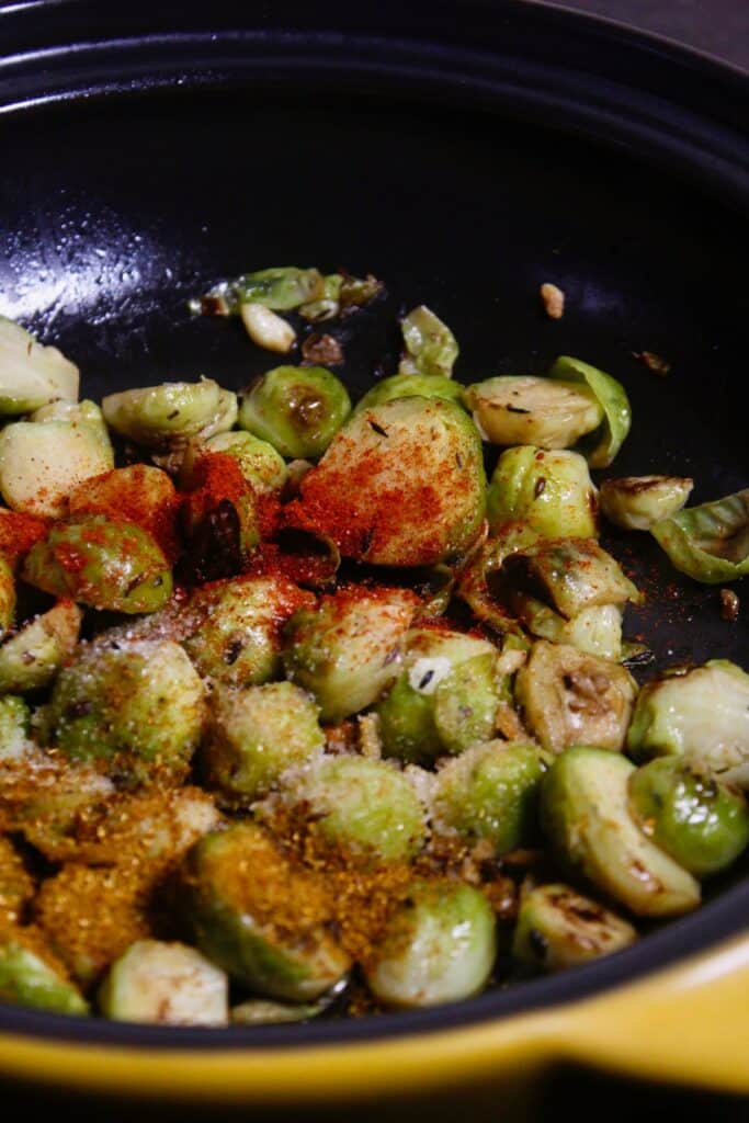 add powdered spices to the pan and mix well 