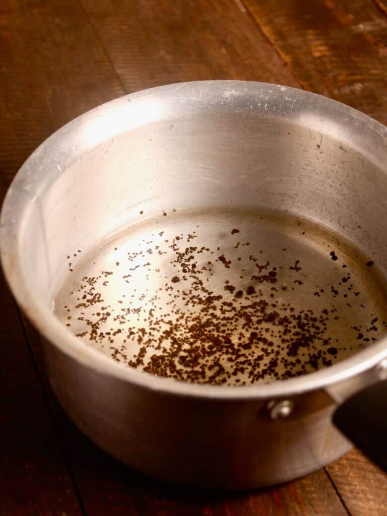 add tea leaves with water in a pan 