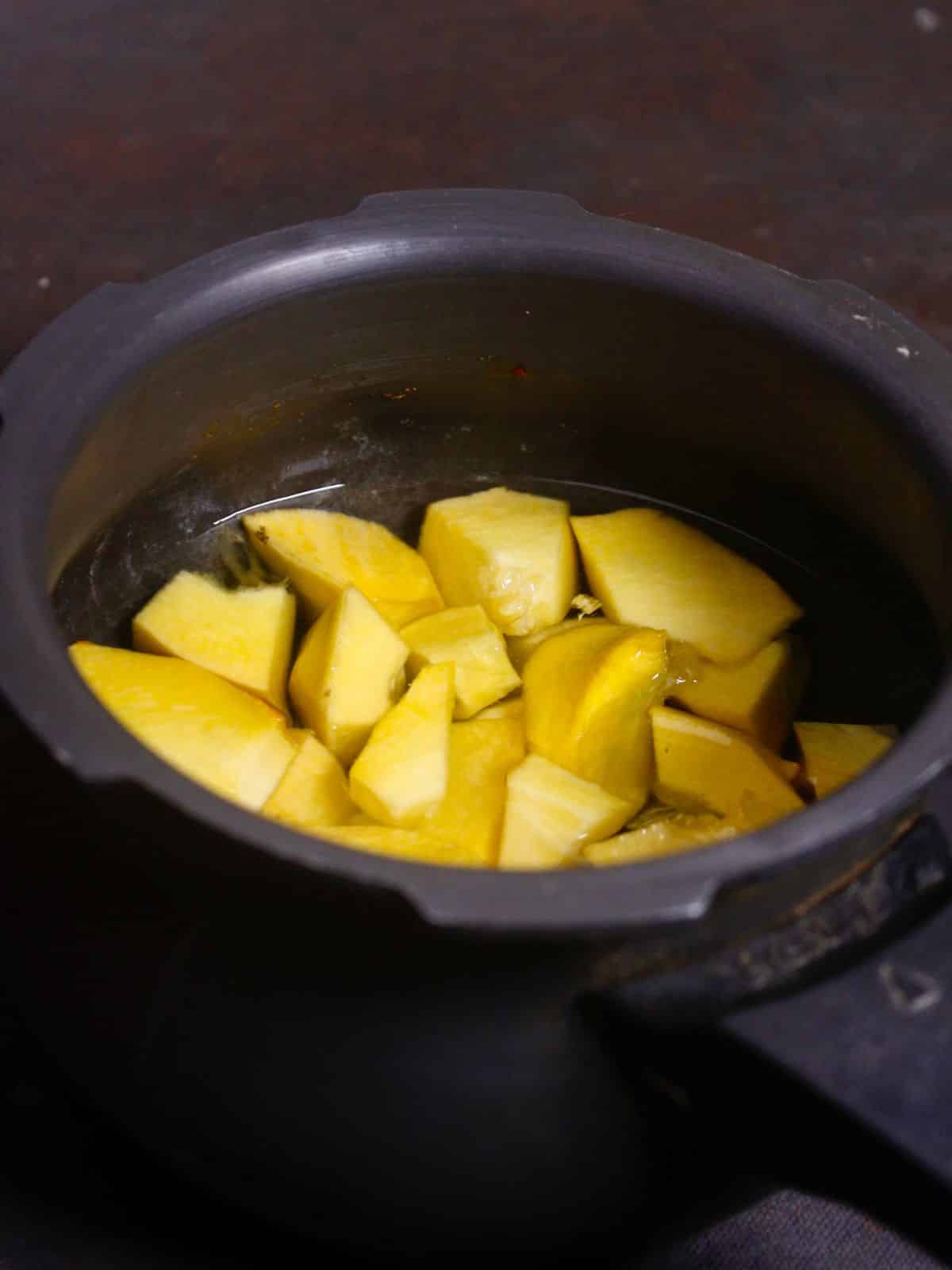 add pumpkins in a cooker