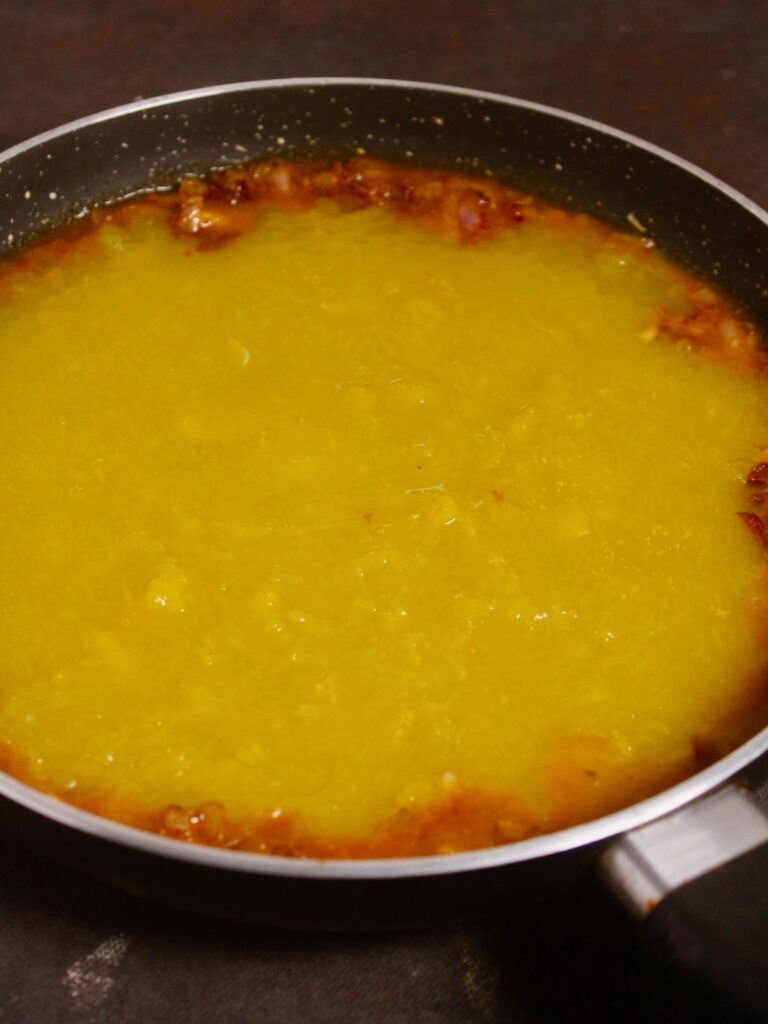 add blended pumpkins to the pan and mix well 