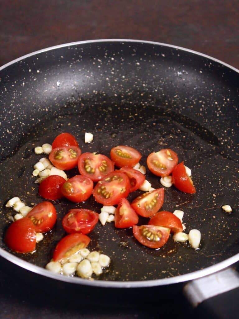 add chopped tomatoes to the pan and saute 